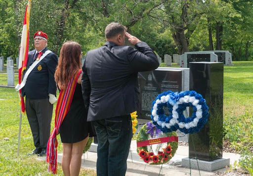 Minister Shawn Nault and Stephanie Meilleur at the wreath 
				laying ceremony. (photo by Pamela Poitras Heinrichs)