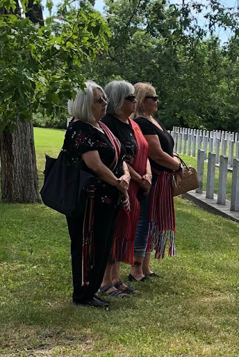 L-R Angel Delorme Stoyko, Diane Delorme Hykaway, Brenda 
				Neufeld-Lapointe proudly wearing their Métis sashes on VJ Day.