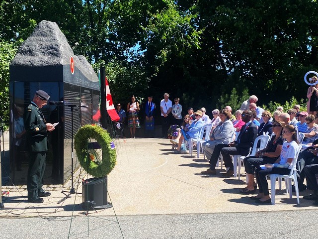 Image: Warrant Officer J. Kenneth L. Doyle giving the Act of 
					Remembrance.