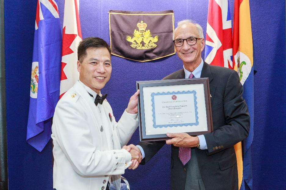 Larry Lau, receiving a certificate of appreciation