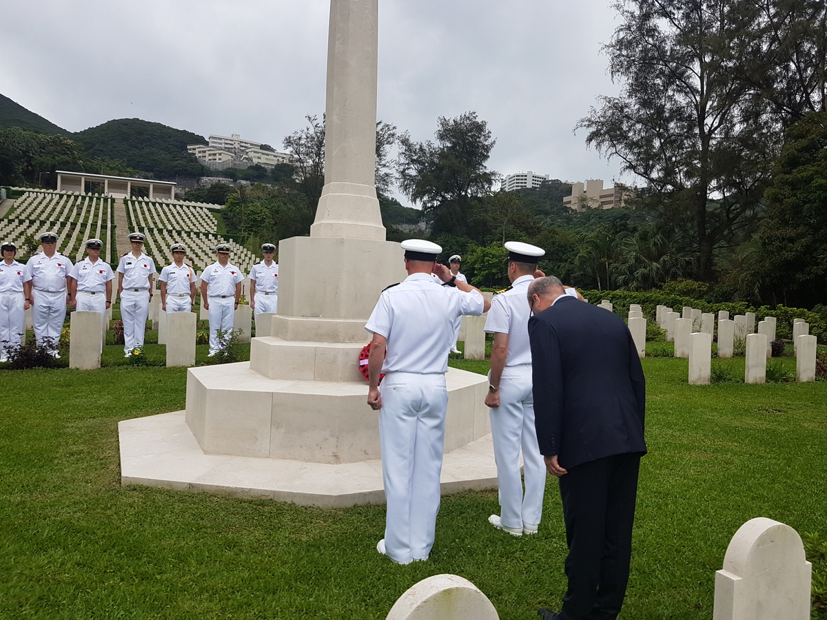 Crew of HMCS Vancouver paying tribute at a ceremony at Sai Wan Cemetery