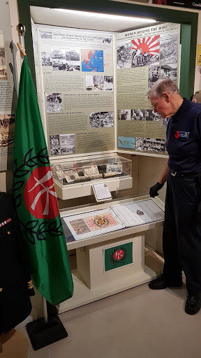 Mr. Brian McFadden examining the South East Asia POW 
						Display