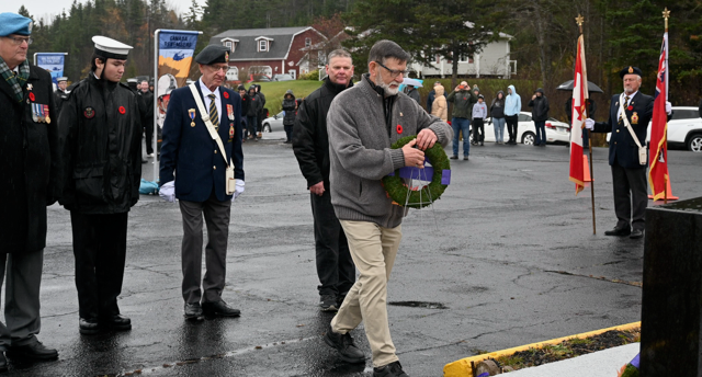 Image: Remembrance Day ceremony at Legion Branch 150, Nov 11,2024.
		Bernard LeBlanc along with 3 of his brothers laid a wreath for the HK 
		POWs. (Photo used by permission)